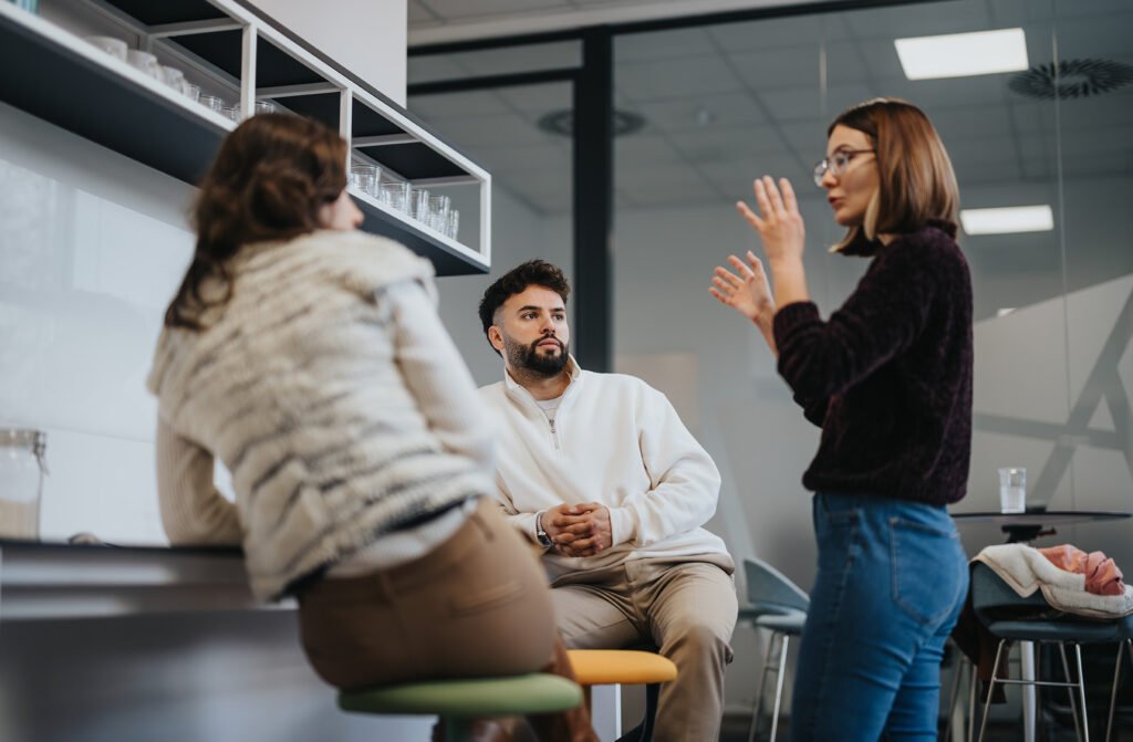 businesspeople,collaborating,in,a,modern,kitchen,,discussing,statistics,and,sharing